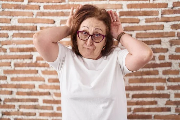 Senior Woman Glasses Standing Bricks Wall Doing Bunny Ears Gesture — Fotografia de Stock