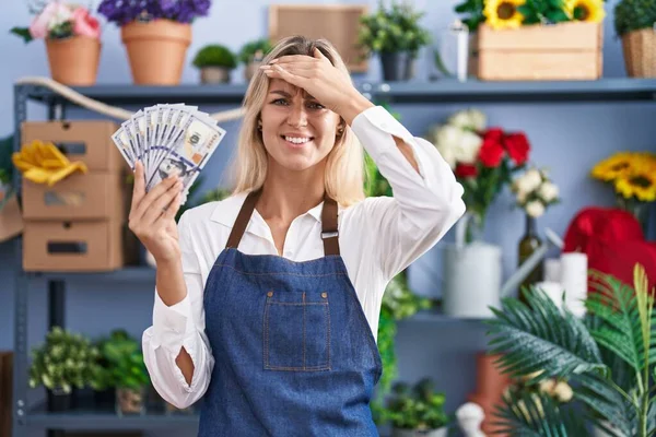 Young Blonde Woman Working Florist Shop Holding Dollars Stressed Frustrated — Stockfoto
