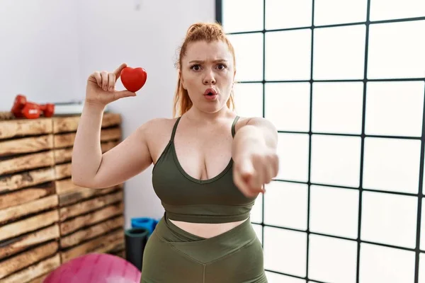 Young Redhead Woman Holding Heart Gym Pointing Finger Camera You — Foto de Stock