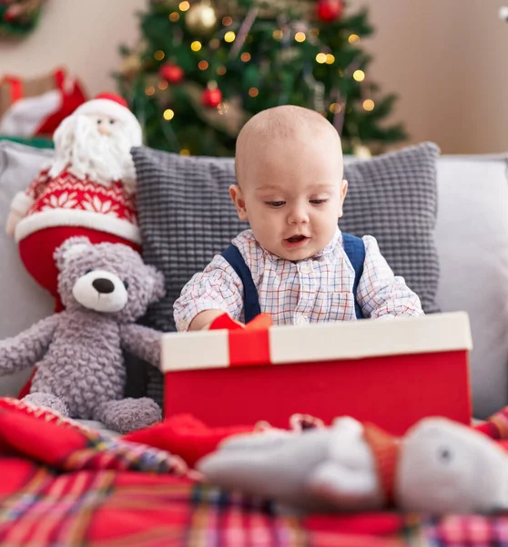 Adorable Caucasian Baby Holding Gift Sitting Sofa Christmas Tree Home — Stock Photo, Image