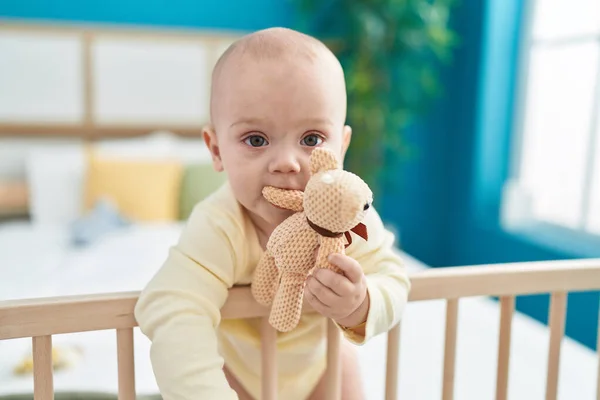 Adorable Caucasian Baby Standing Cradle Biting Doll Bedroom — Stock Photo, Image