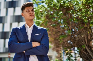Young man relaxed wearing suit at park