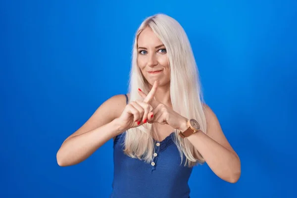 Caucasian Woman Standing Blue Background Rejection Expression Crossing Fingers Doing — 图库照片