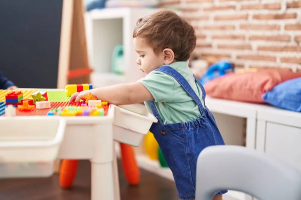 Adorable Hispanic Toddler Playing Construction Blocks Standing Kindergarten — Stock Photo, Image