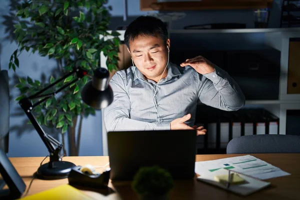 Young Chinese Man Working Using Computer Laptop Night Gesturing Hands — 스톡 사진