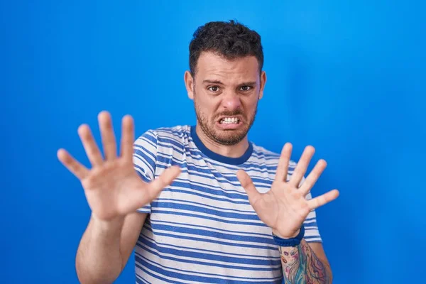Young Hispanic Man Standing Blue Background Afraid Terrified Fear Expression — Stockfoto