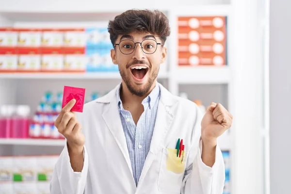 Arab Man Beard Working Pharmacy Drugstore Holding Condom Shock Face — ストック写真