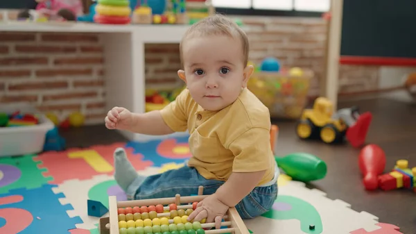 Adorable Hispanic Baby Playing Abacus Sitting Floor Kindergarten — Stockfoto