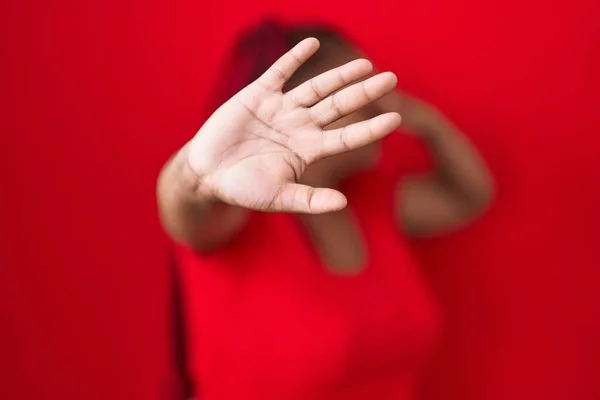 African American Woman Braided Hair Standing Red Background Covering Eyes — Foto Stock