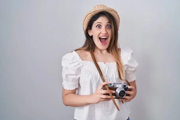 Young Brunette Woman Holding Vintage Camera Celebrating Crazy Amazed Success — Stock fotografie