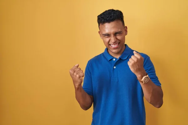 Young Hispanic Man Standing Yellow Background Very Happy Excited Doing — ストック写真