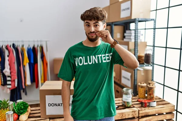 Young Arab Man Wearing Volunteer Shirt Donations Stand Mouth Lips — Fotografia de Stock