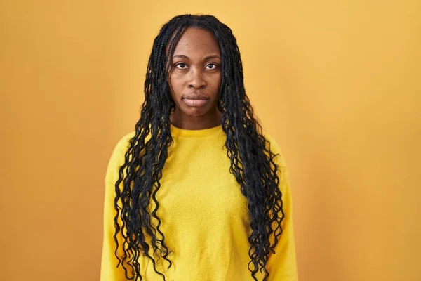 African Woman Standing Yellow Background Relaxed Serious Expression Face Simple — Stock Photo, Image