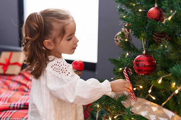 Adorable Hispanic Girl Decorating Christmas Tree Home — Stock Photo, Image