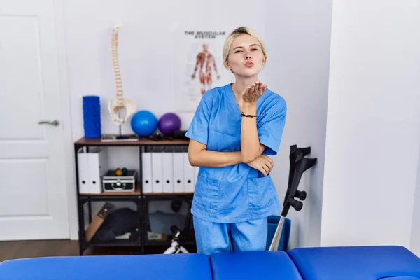 Young Physiotherapist Woman Working Pain Recovery Clinic Looking Camera Blowing — Stock Photo, Image