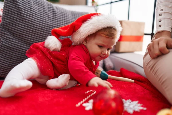 Adorable Redhead Toddler Holding Christmas Decoration Ball Sitting Sofa Home — Stock Photo, Image