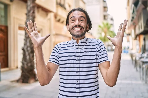 Young Hispanic Man Beard Outdoors City Celebrating Crazy Amazed Success — Stockfoto