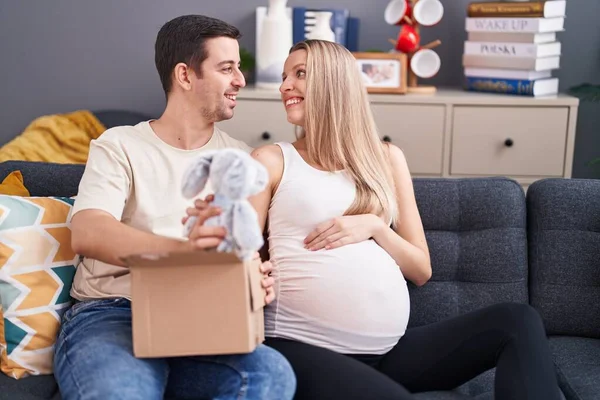 Man Woman Couple Expecting Baby Unpacking Rabbit Doll Home — Stock Photo, Image