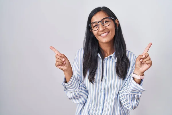 Young Hispanic Woman Wearing Glasses Smiling Confident Pointing Fingers Different — Stok fotoğraf