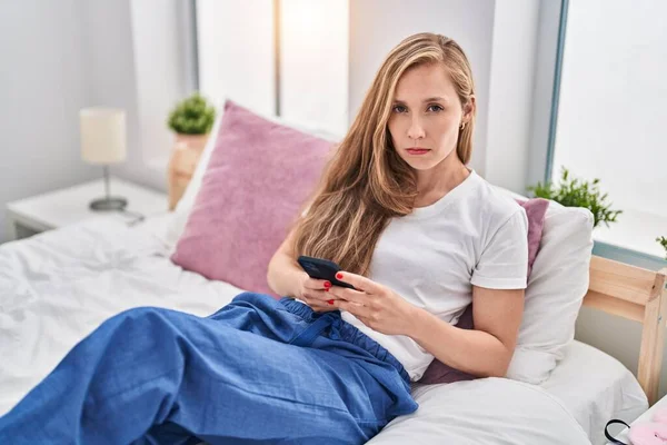 Young Blonde Woman Using Smartphone Bed Depressed Worry Distress Crying — Stock Photo, Image