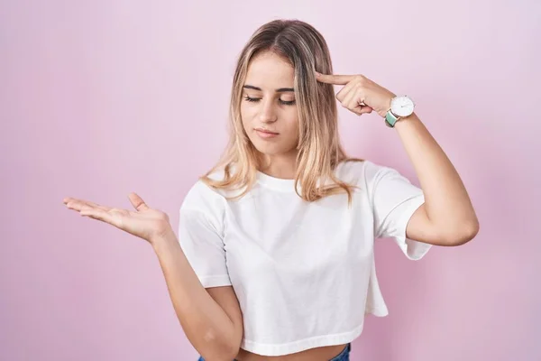 Young Blonde Woman Standing Pink Background Confused Annoyed Open Palm — Stock Photo, Image
