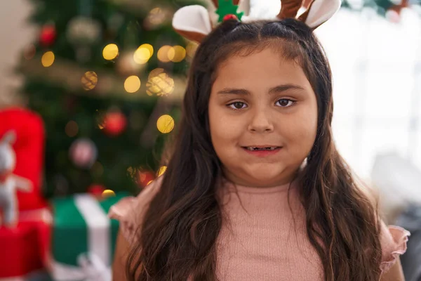Size Hispanic Girl Wearing Reindeer Ears Standing Christmas Tree Home —  Fotos de Stock