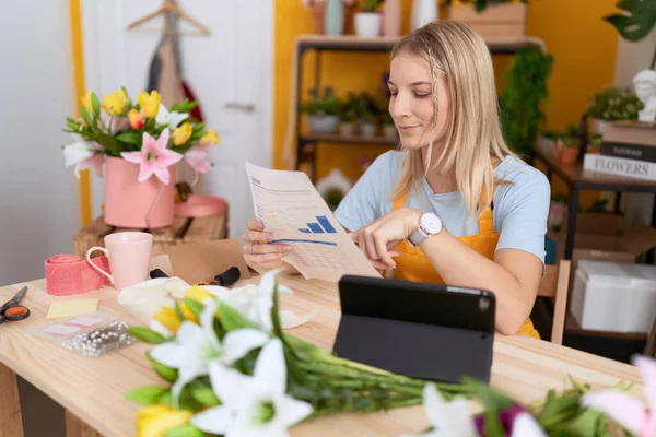 Young Blonde Woman Florist Using Touchpad Reading Document Flower Shop — Stockfoto