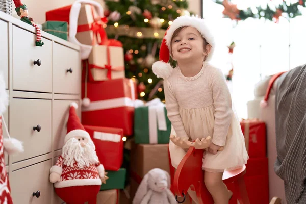 Adorable Girl Sitting Rocking Reindeer Christmas Tree Home — Stock Photo, Image