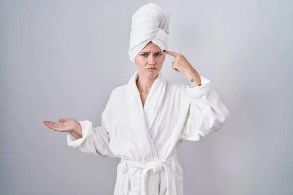 Blonde Caucasian Woman Wearing Bathrobe Confused Annoyed Open Palm Showing — Stock Photo, Image