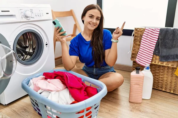 Young Brunette Woman Doing Laundry Using Smartphone Big Smile Face — Stock Photo, Image