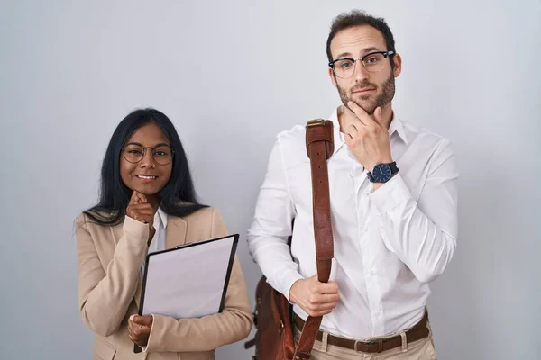 Interracial Business Couple Wearing Glasses Hand Chin Thinking Question Pensive — Stok fotoğraf