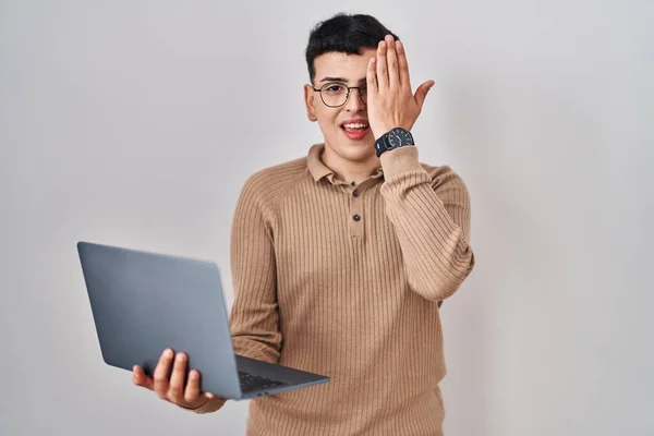 Non Binary Person Using Computer Laptop Covering One Eye Hand — 스톡 사진