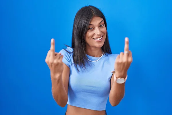 Brunette Young Woman Standing Blue Background Showing Middle Finger Doing — Stock fotografie