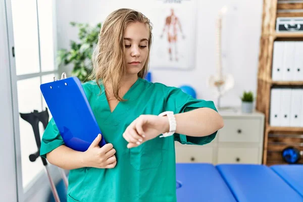 Young Caucasian Woman Working Pain Recovery Clinic Checking Time Wrist — Stok fotoğraf