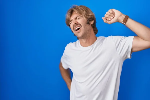 Middle Age Man Standing Blue Background Stretching Back Tired Relaxed — Stockfoto