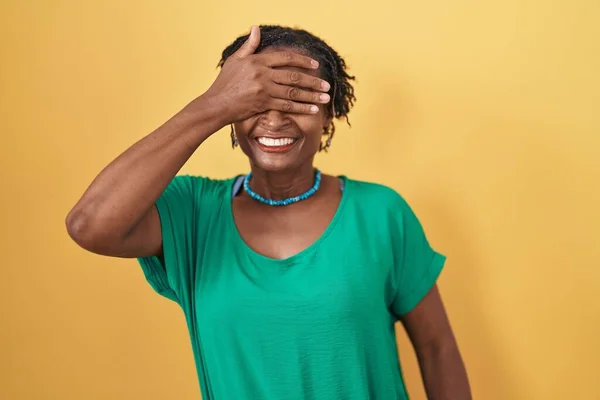African Woman Dreadlocks Standing Yellow Background Smiling Laughing Hand Face — Fotografia de Stock
