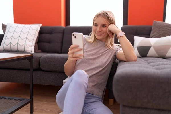 Young Blonde Woman Using Smartphone Sitting Floor Home — Stockfoto