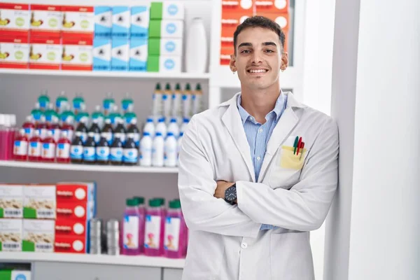 Young Hispanic Man Pharmacist Smiling Confident Standing Arms Crossed Gesture — Stok fotoğraf