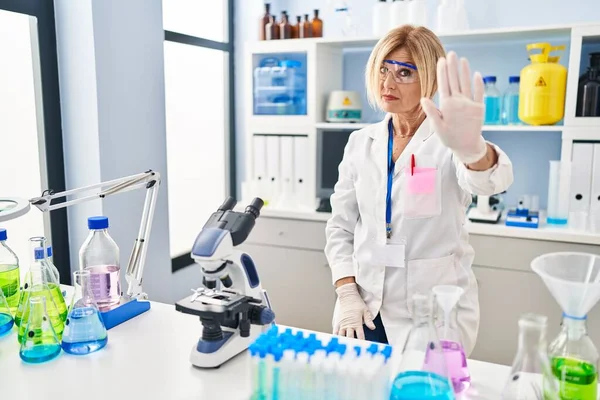 Middle Age Blonde Woman Working Scientist Laboratory Doing Stop Sing — ストック写真