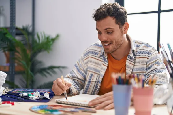 Young Hispanic Man Artist Drawing Notebook Art Studio — Stockfoto