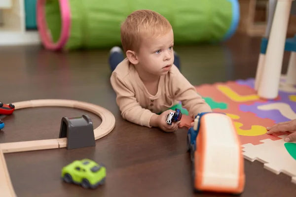Adorable Toddler Playing Car Toy Lying Floor Kindergarten — Stock Photo, Image