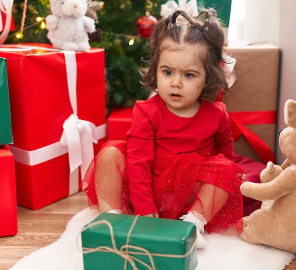 Adorable Hispanic Girl Sitting Floor Christmas Tree Home — Fotografia de Stock