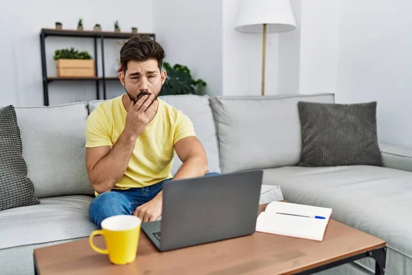 Young Man Beard Using Laptop Home Bored Yawning Tired Covering — Fotografia de Stock