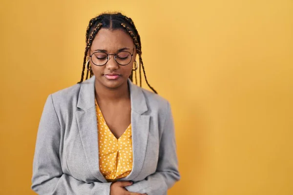 African American Woman Braids Standing Yellow Background Hand Stomach Because — Stockfoto