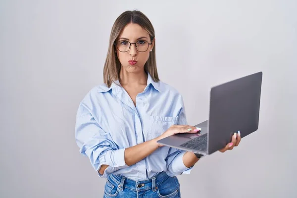 Young Woman Working Using Computer Laptop Puffing Cheeks Funny Face — Zdjęcie stockowe