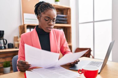 African american woman business worker working at office