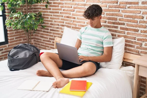 Young Hispanic Teenager Student Sitting Bed Studying Bedroom — Stockfoto