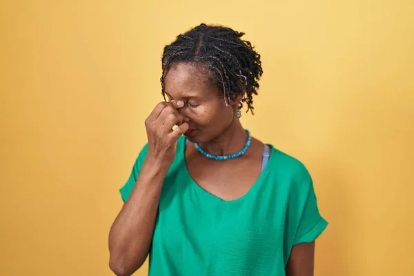 African Woman Dreadlocks Standing Yellow Background Tired Rubbing Nose Eyes — Fotografia de Stock