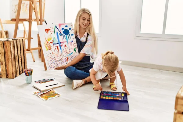 Mother Daughter Smiling Confident Drawing Canvas Sitting Floor Art Studio — 图库照片