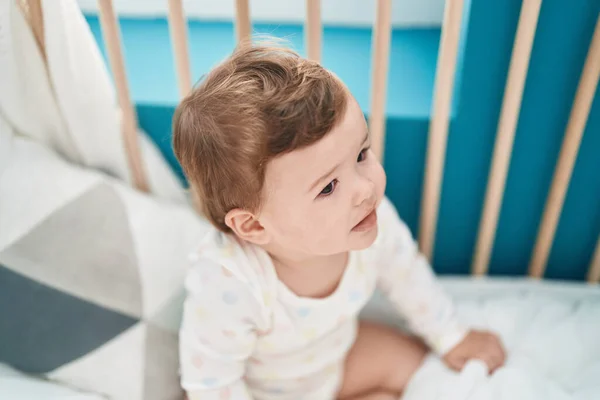 Adorable Caucasian Baby Sitting Cradle Bedroom — Stock Photo, Image